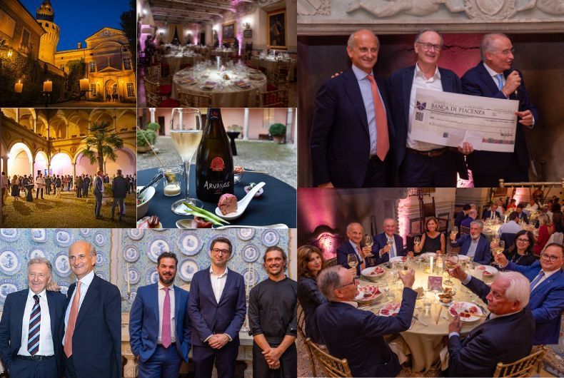 Cena di gala Gambero Rosso a Rivalta: persone, cibo, brindisi, assegno Banca di Piacenza, bottiglia Arvange, location storica, evento.