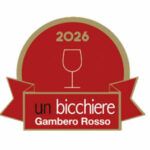 Riconoscimento Gambero Rosso "Un bicchiere" 2026 per vino bianco Inedita. Premio di eccellenza enogastronomica italiana.