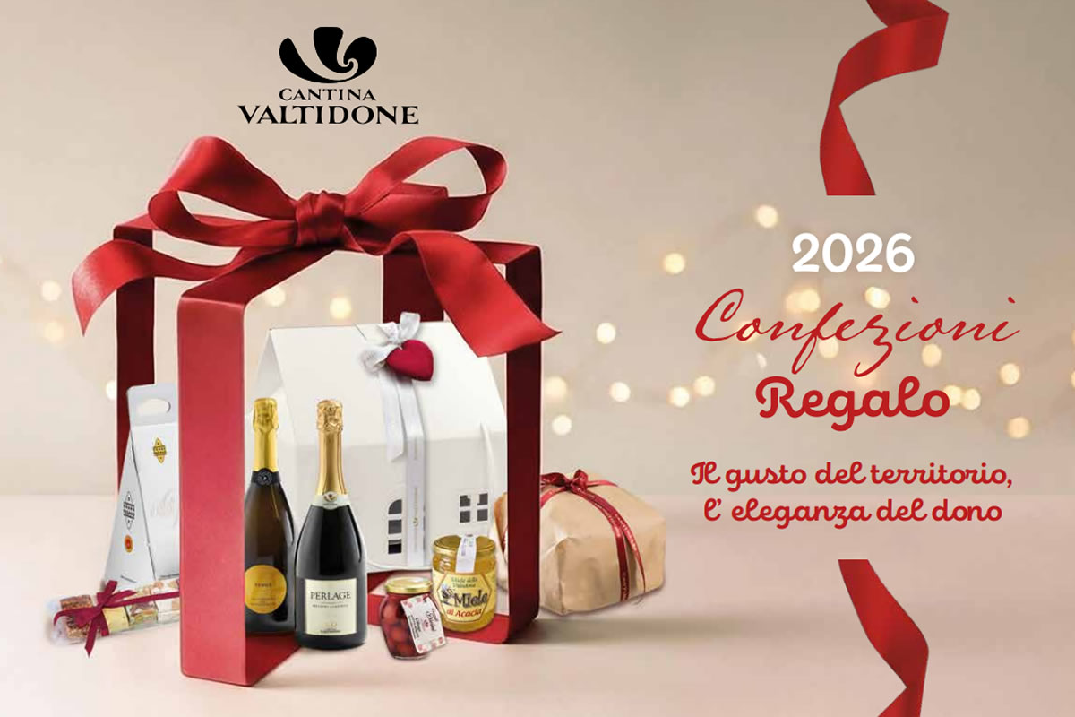 confezioni-regalo-26 Confezioni regalo 2026 di Cantina Valtidone con bottiglie Perlage, miele e dolci in scatola rossa con fiocco, sfondo luminoso.